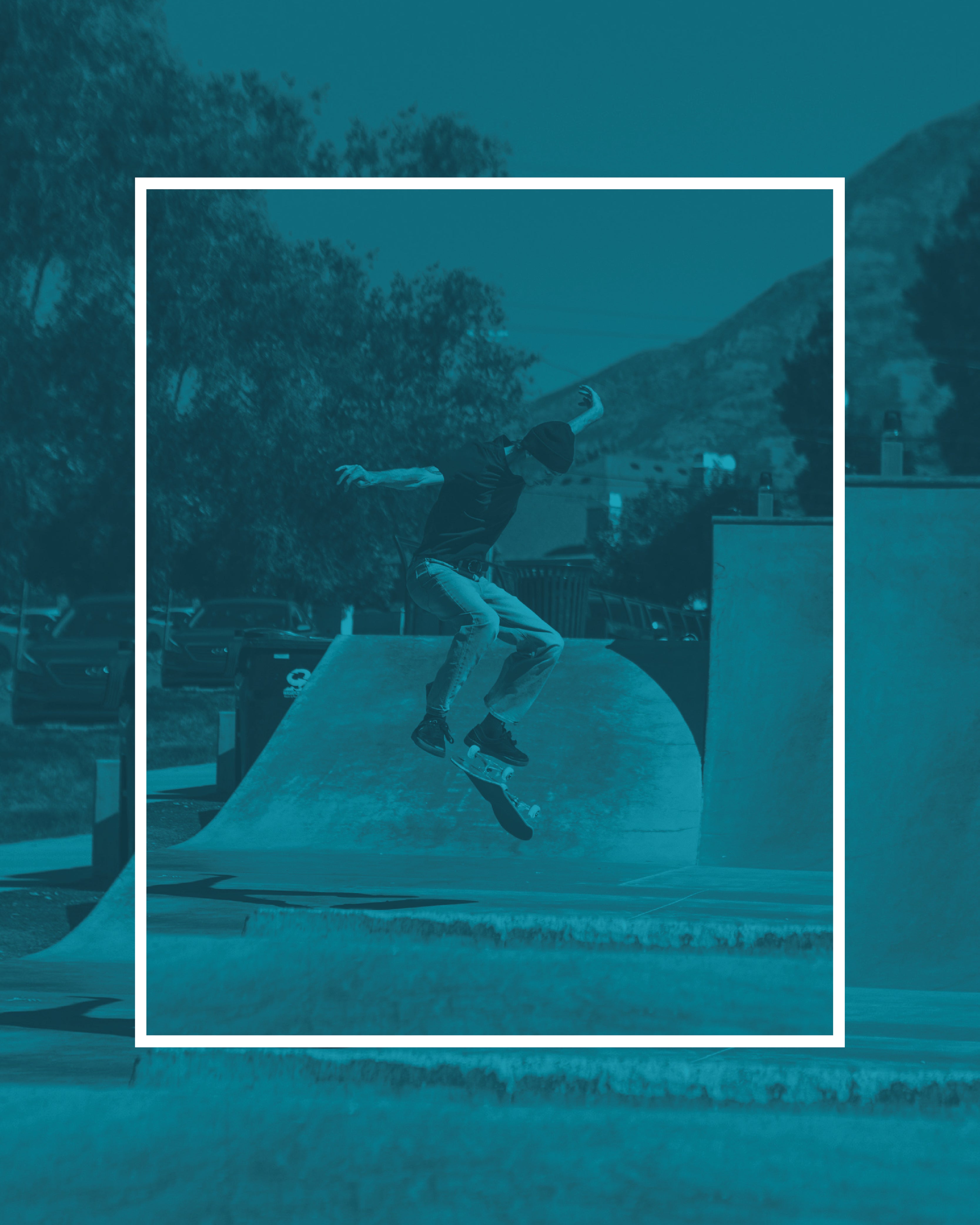 A skateboarder performs an aerial trick above a ramp in a teal-tinted skate park, framed by a white square.