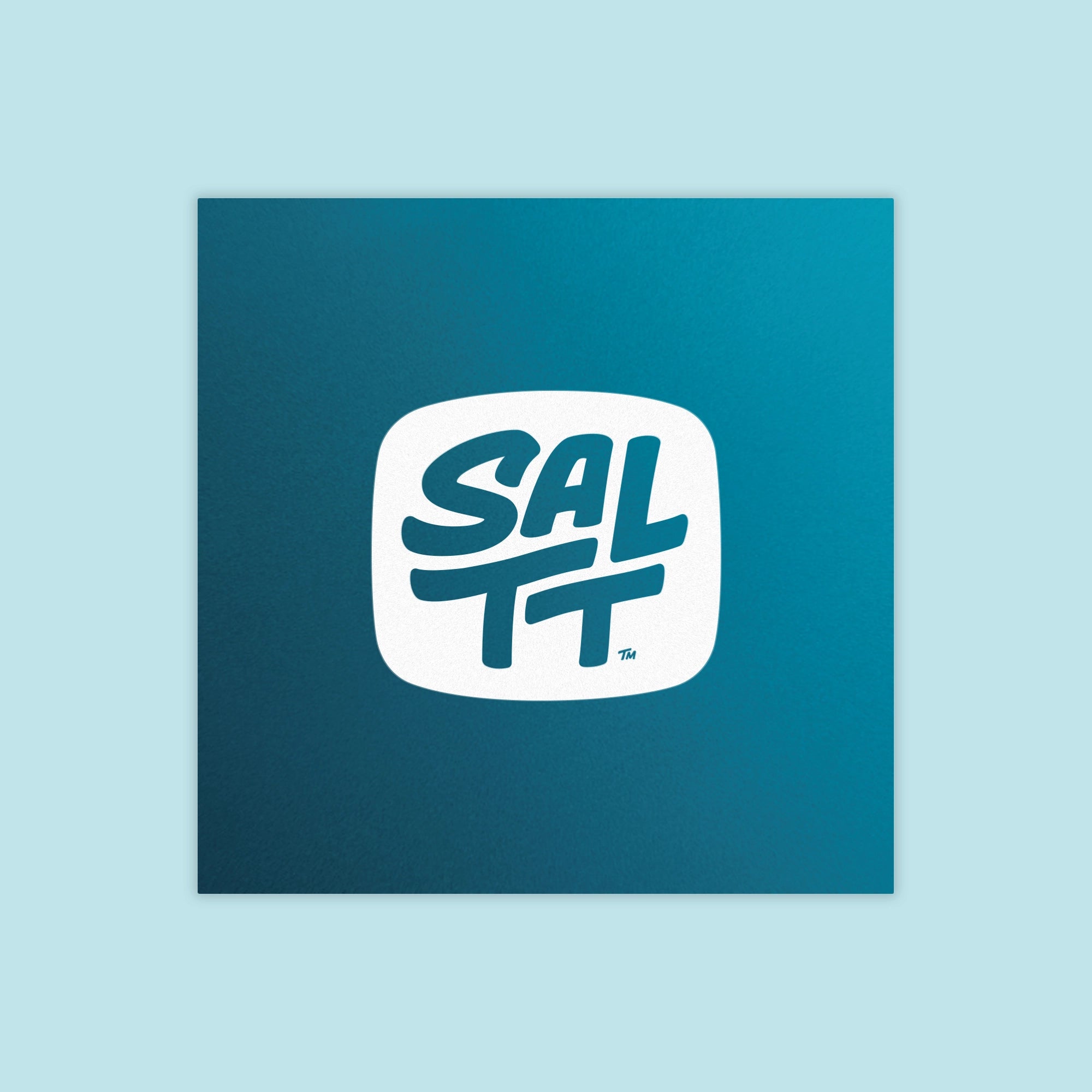 Square, deep teal product packaging with a white logo. The logo is a rounded square containing the bold, stacked text SALTT, with a small TM symbol.