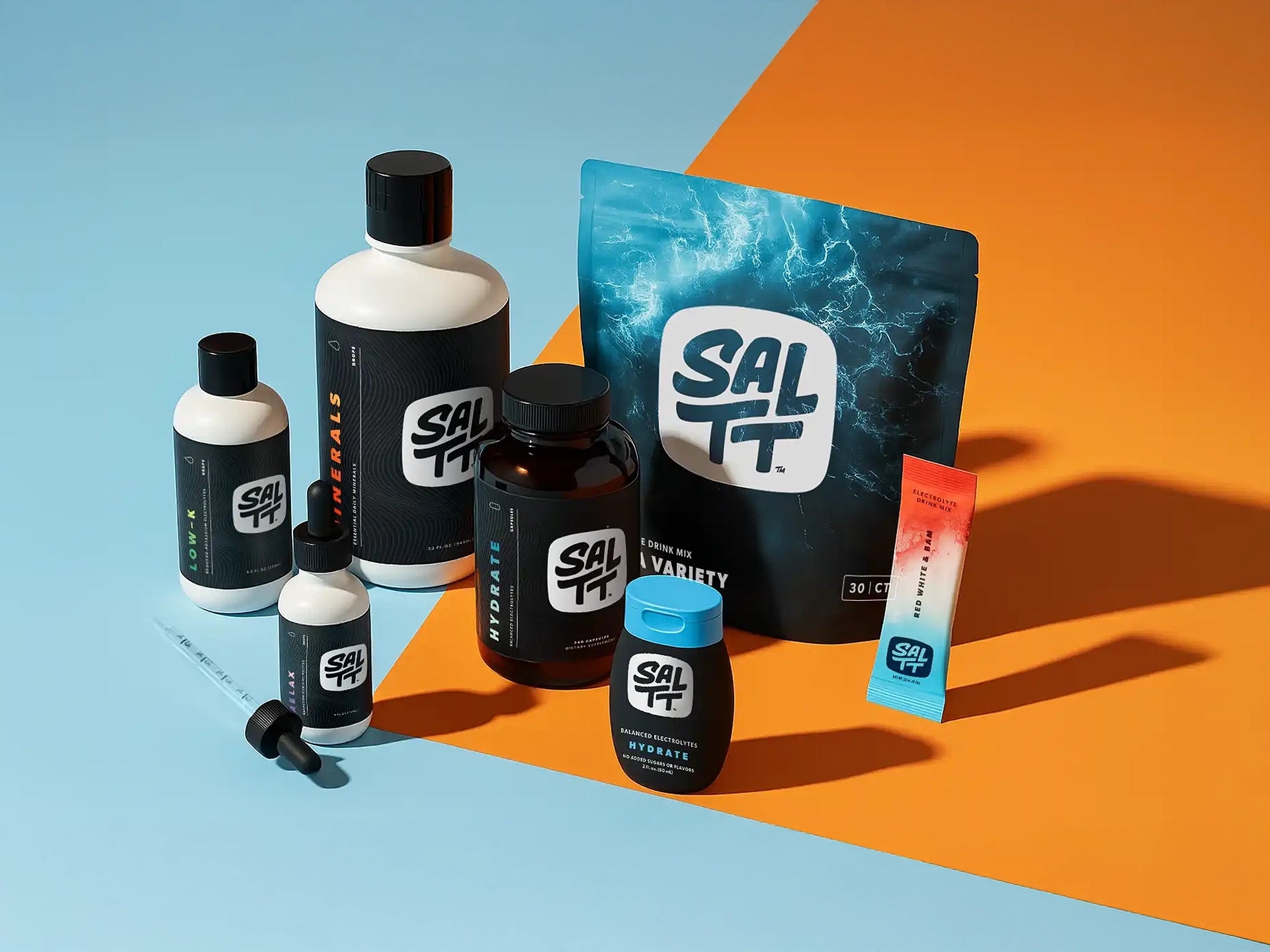 Collection of SALTT products on a blue and orange background