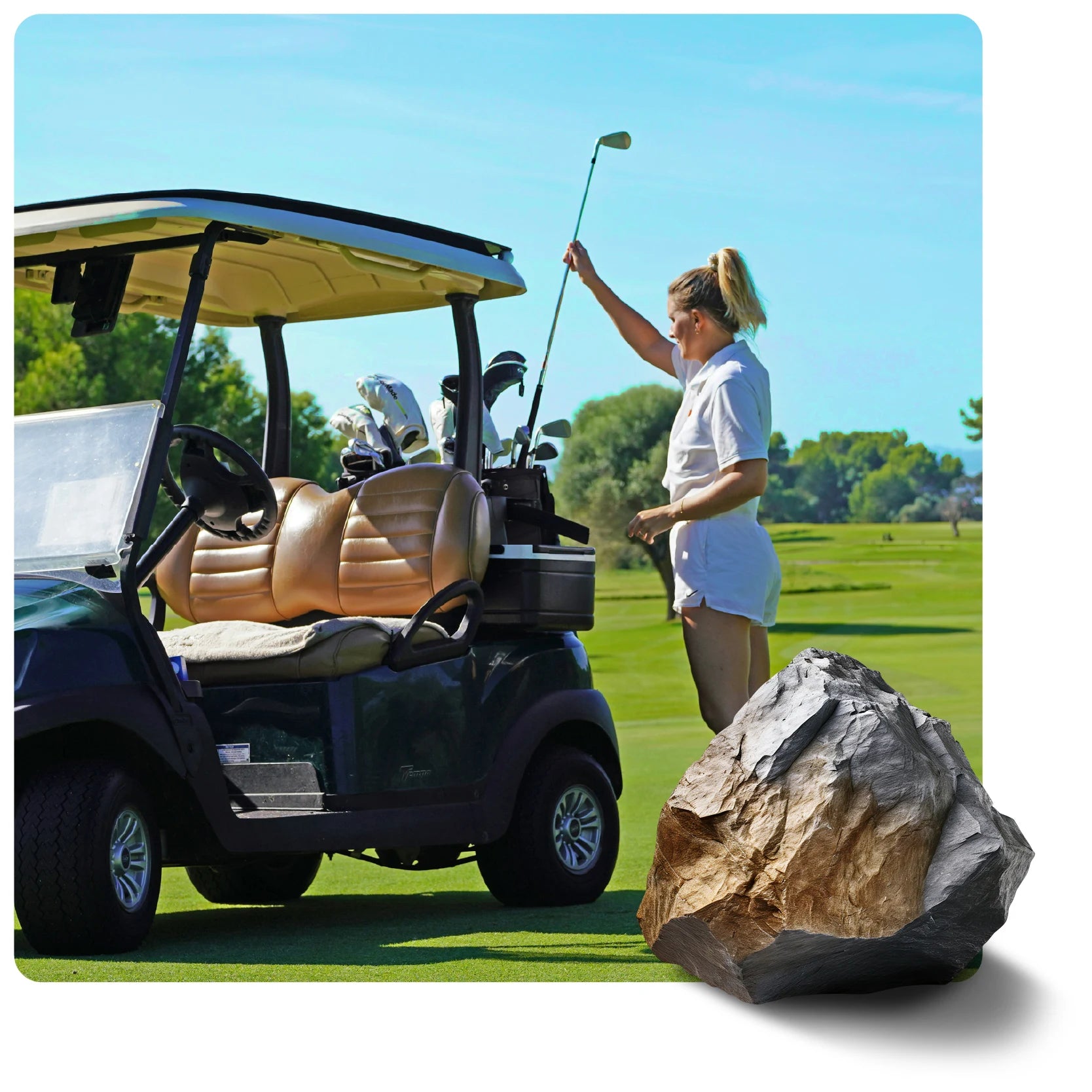 A woman on a sunny golf course stands by a golf cart with a club. A large gray and brown rock sits prominently in the foreground.