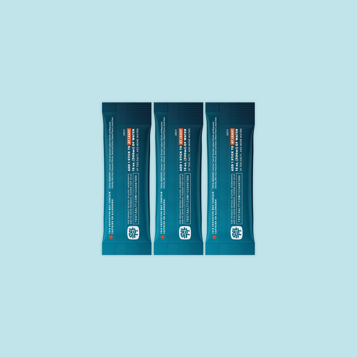 Three teal SALTT stick-pack pouches featuring a light blue ocean water splash graphic and white text for brand and product information.