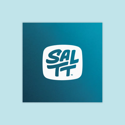 Square, deep teal product packaging with a white logo. The logo is a rounded square containing the bold, stacked text SALTT, with a small TM symbol.