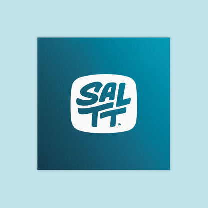 Square, deep teal product packaging with a white logo. The logo is a rounded square containing the bold, stacked text SALTT, with a small TM symbol.