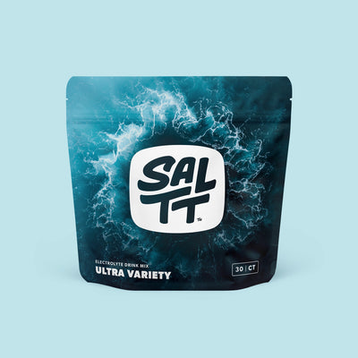 SALTT Electrolyte Drink Mix Mixed Variety stand-up pouch. The pouch is dark blue to teal with white wavy patterns. It features a white SALTT logo, white text Electrolyte Drink Mix Mixed Variety, and a black box with 30 CT.