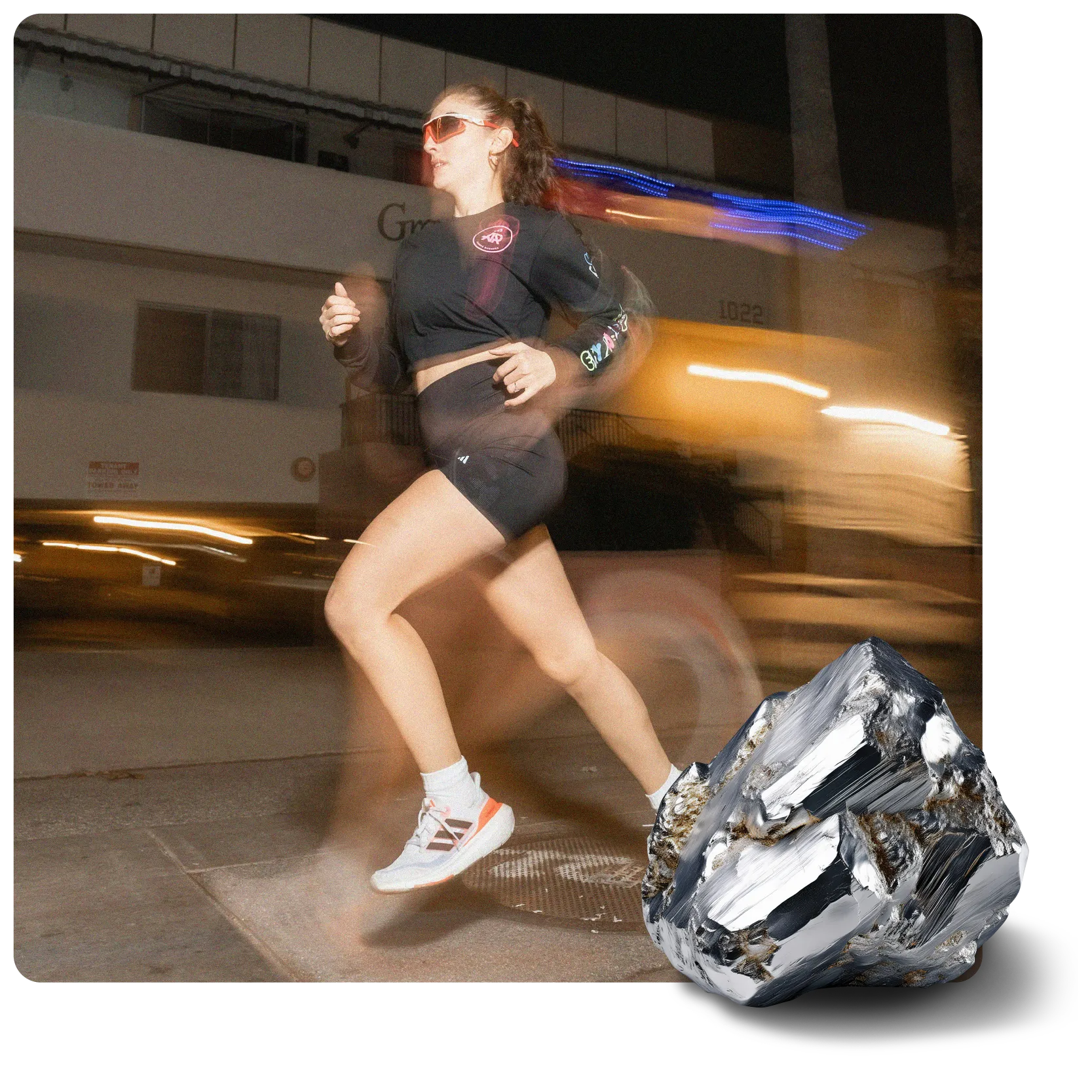 A motion-blurred woman runs left on a city street at night. A large, silvery, faceted mineral rock is in the bottom right corner.